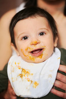 Portrait of baby with babyfood around mouth